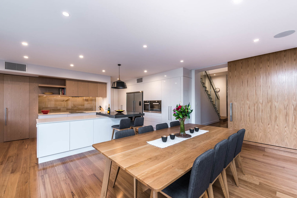 This is an example of a contemporary dining room in Adelaide.