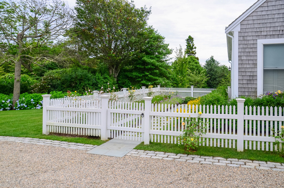 Photo of an expansive traditional front yard full sun driveway for summer in Boston.