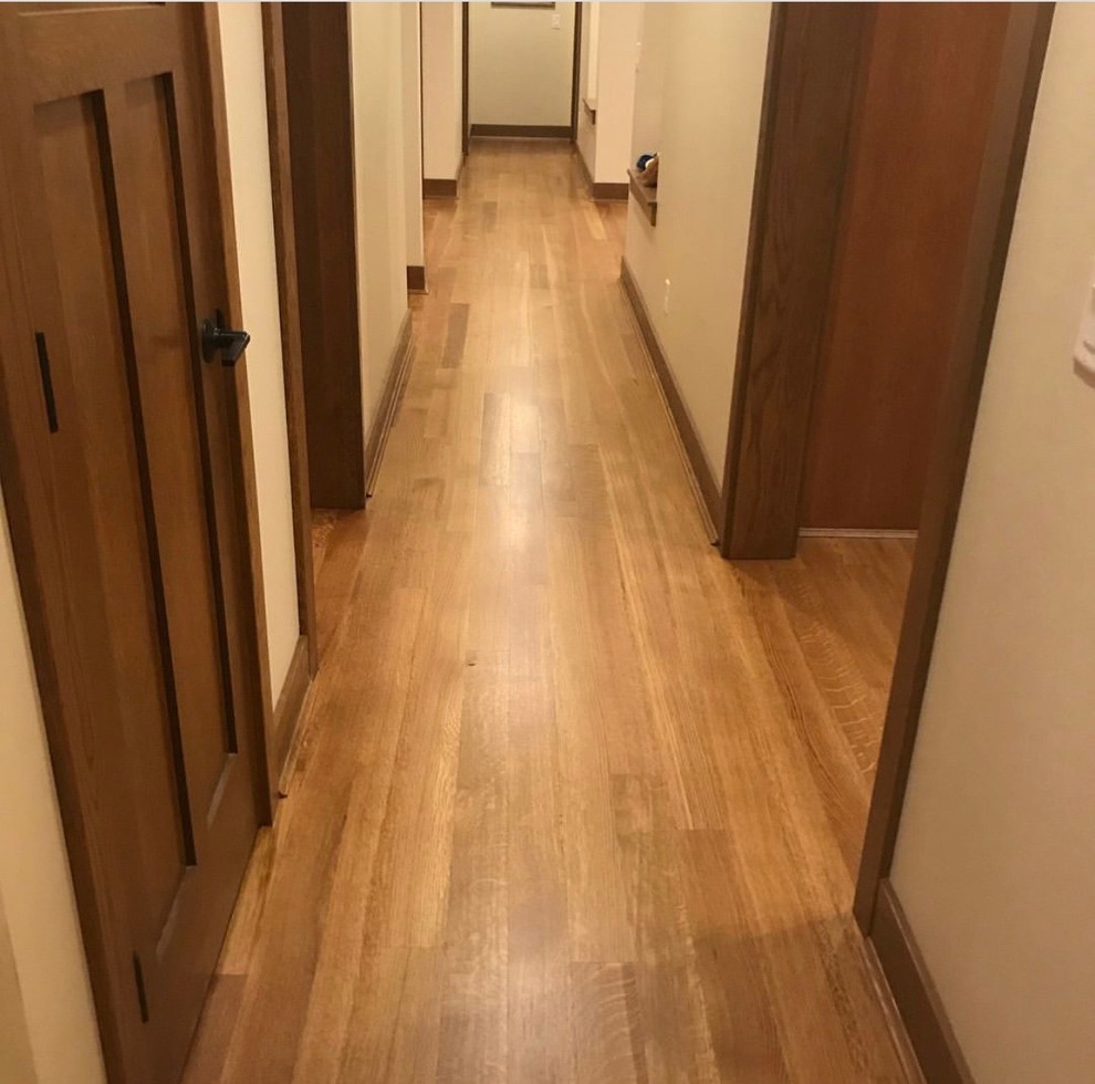 Mid-sized traditional hallway in San Francisco with white walls, medium hardwood floors and brown floor.