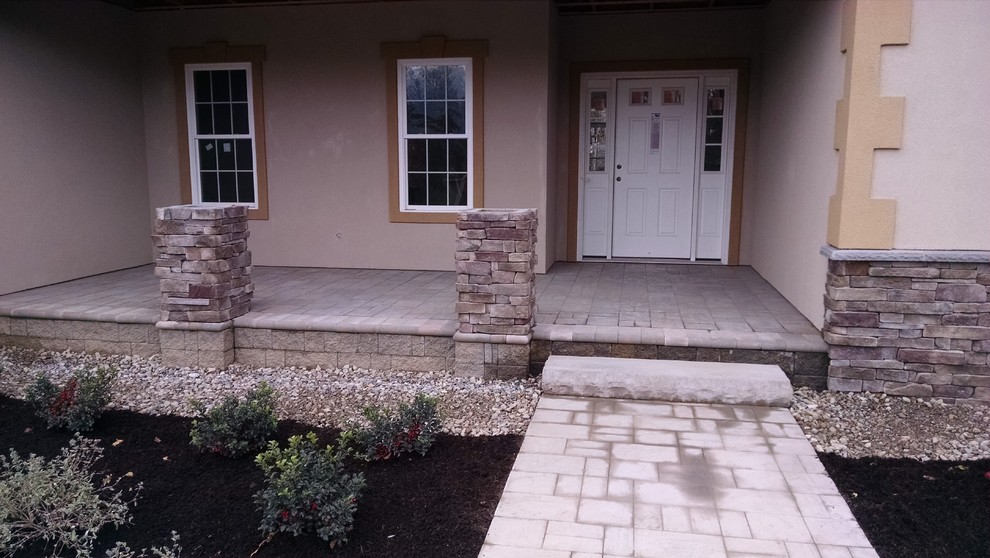 Example of a small transitional brick floor front door design in Boston with beige walls and a white front door