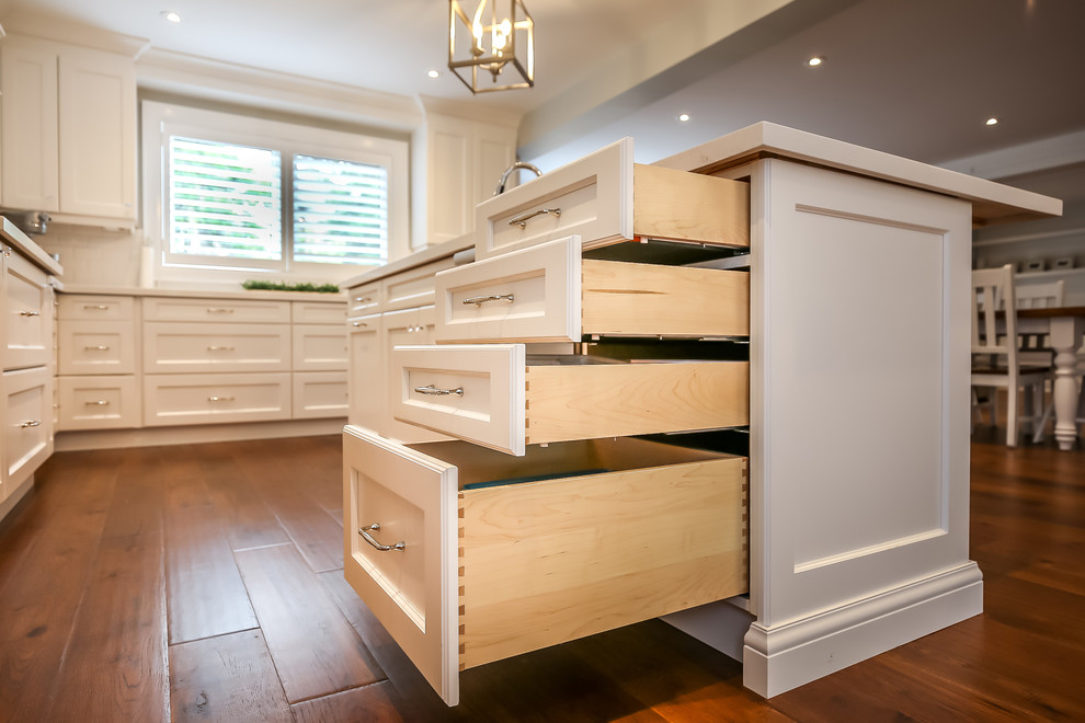 Example of a transitional kitchen design in Toronto