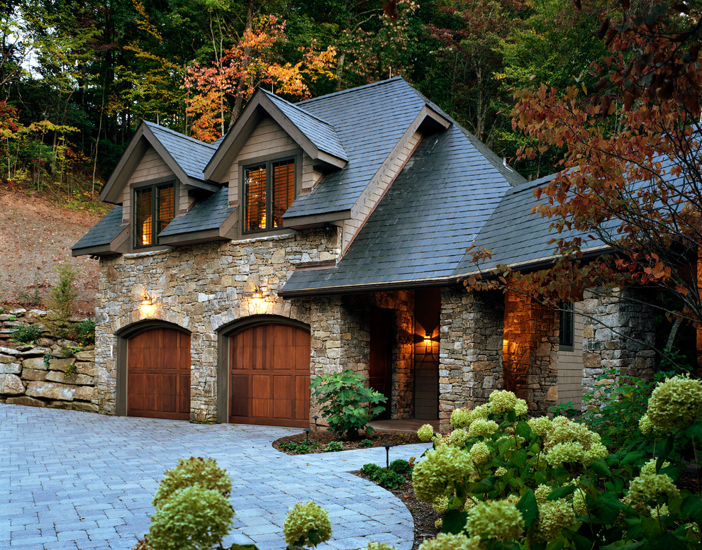 Design ideas for a traditional three-storey grey house exterior in Atlanta with stone veneer.