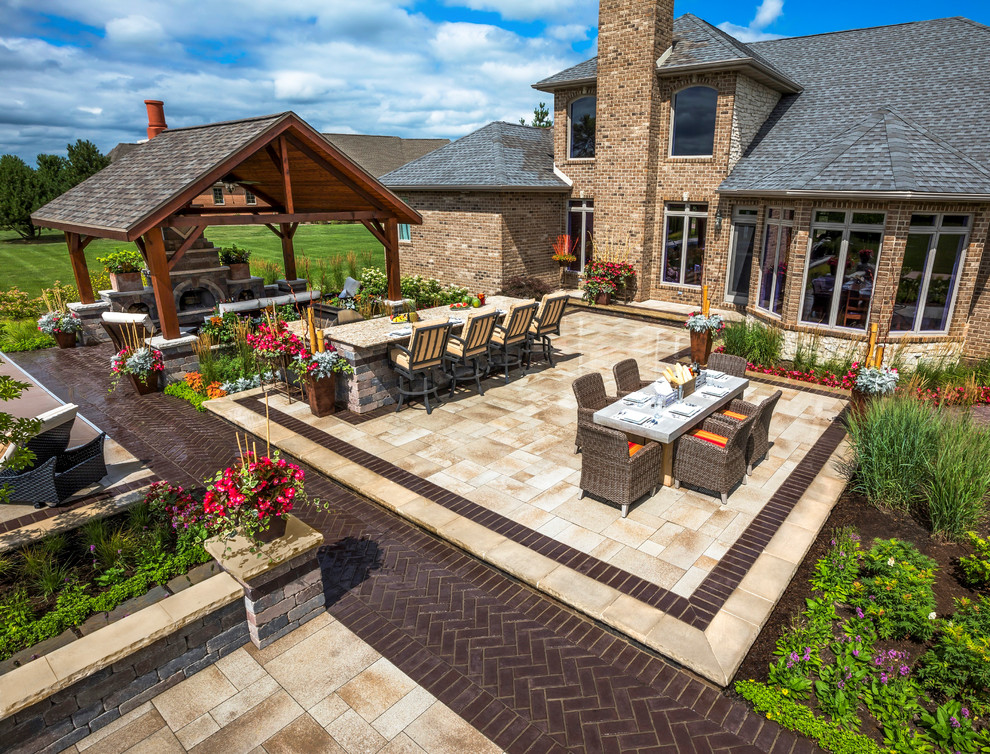 Inspiration for a contemporary backyard patio in Other with an outdoor kitchen, concrete pavers and a pergola.