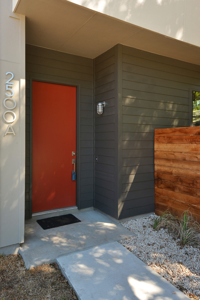 Single front door - modern single front door idea in Austin with a red front door