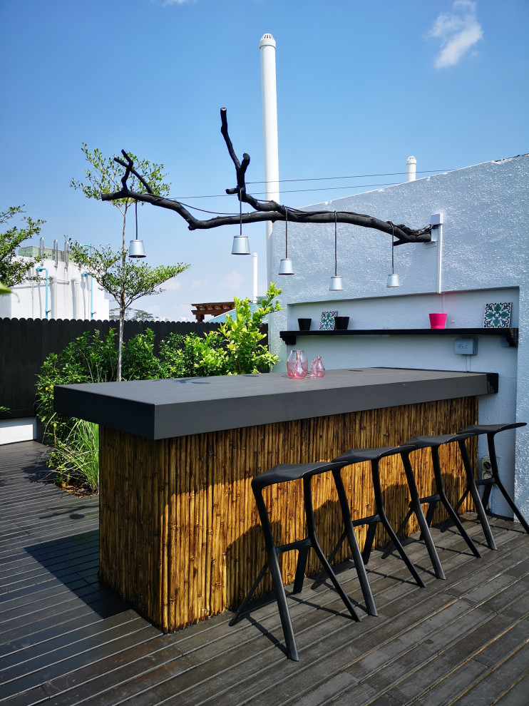 Tropical rooftop and rooftop deck in Singapore with no cover.