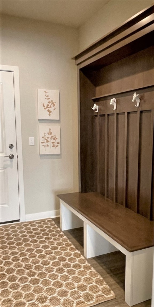 Example of a small transitional vinyl floor and brown floor mudroom design in Chicago