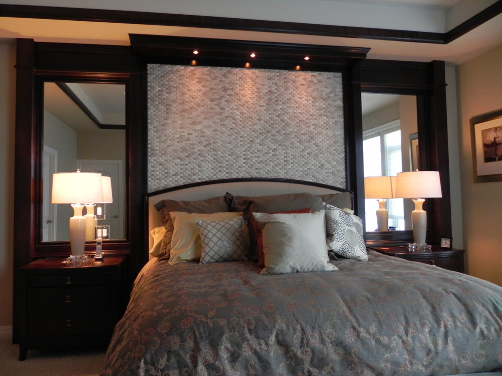 This is an example of a traditional master bedroom in Seattle with beige walls and carpet.