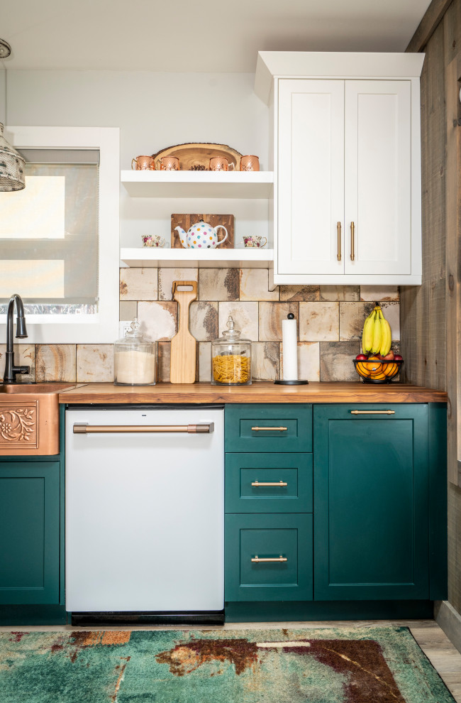Inspiration for a small country l-shaped kitchen in Other with a farmhouse sink, shaker cabinets, green cabinets, wood benchtops, beige splashback, ceramic splashback, white appliances, medium hardwood floors, with island, brown floor and brown benchtop.