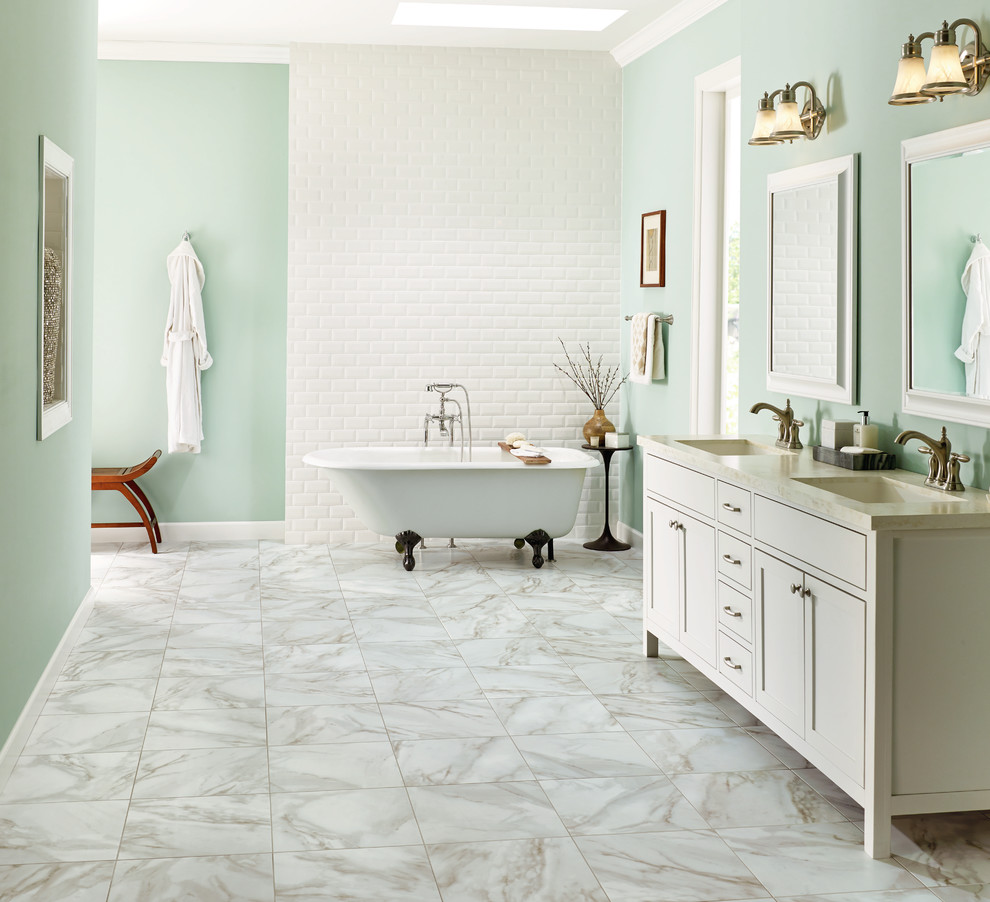 Large transitional master bathroom in Orange County with shaker cabinets, white cabinets, a freestanding tub, an alcove shower, gray tile, porcelain tile, green walls, marble floors, an undermount sink and granite benchtops.