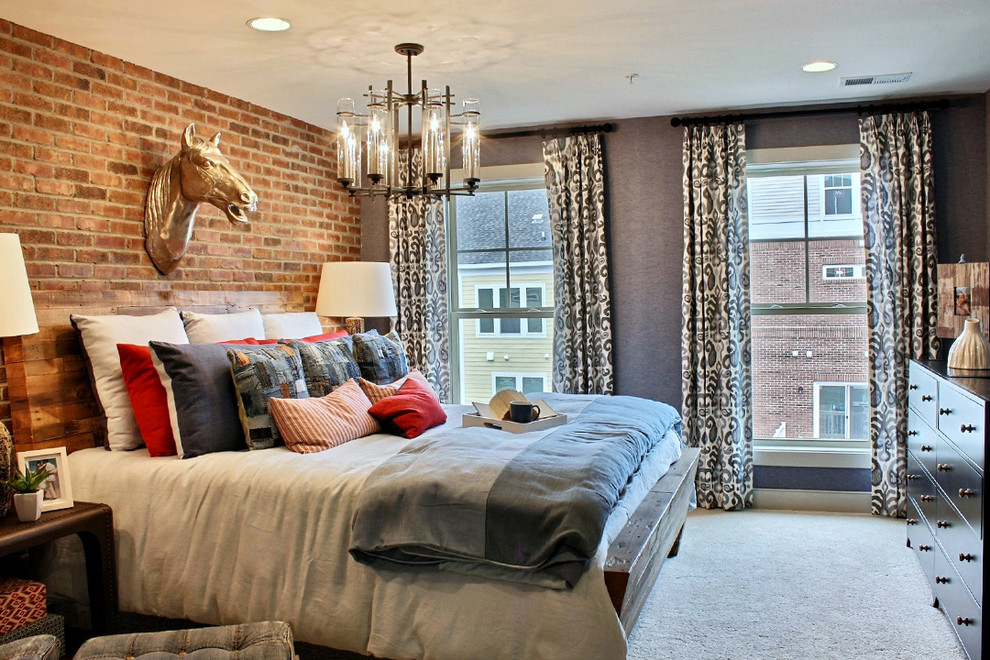 This is an example of a contemporary master bedroom in DC Metro with brown walls and carpet.