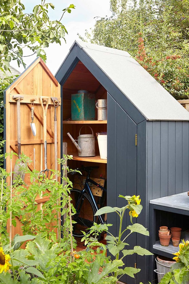 This is an example of a transitional detached garden shed in London.