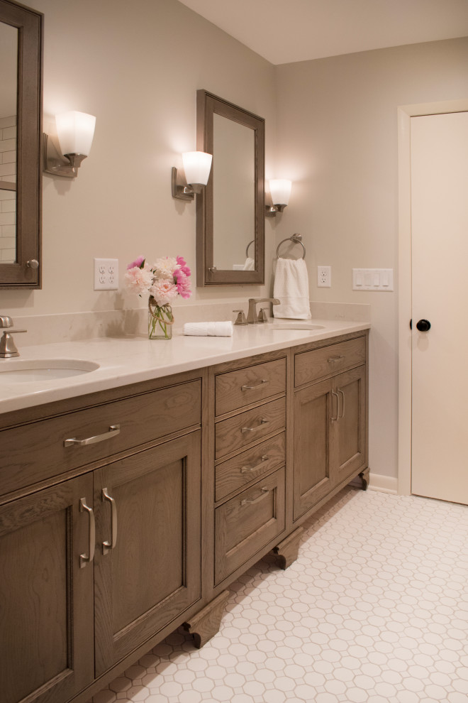 Inspiration for a mid-sized transitional master mosaic tile floor and beige floor bathroom remodel with furniture-like cabinets, medium tone wood cabinets, beige walls, an undermount sink, quartz countertops and beige countertops