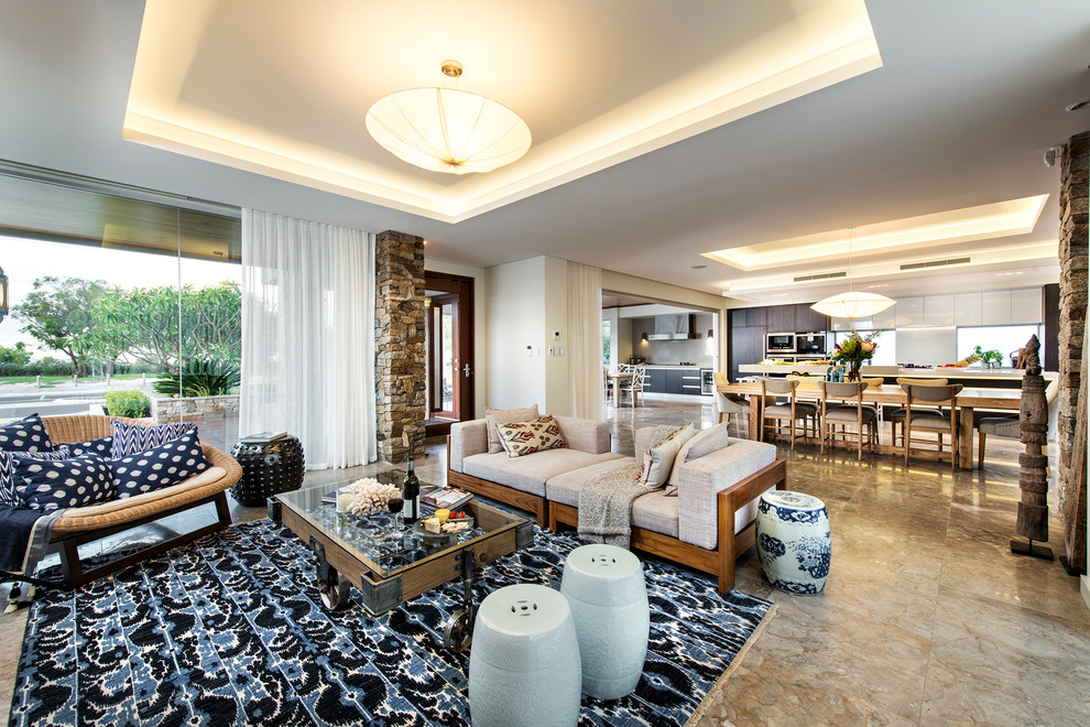 This is an example of a large beach style open concept living room in Perth with marble floors, a wall-mounted tv and beige walls.