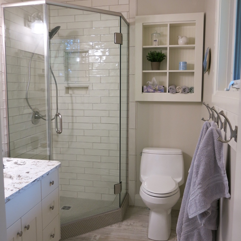 Design ideas for a small traditional master bathroom in Other with shaker cabinets, white cabinets, a corner shower, white tile, ceramic tile, grey walls, porcelain floors, an undermount sink, engineered quartz benchtops, grey floor, a hinged shower door and white benchtops.