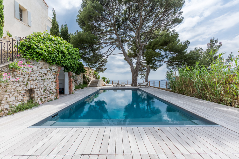 Design ideas for a contemporary rectangular lap pool in Marseille with decking.