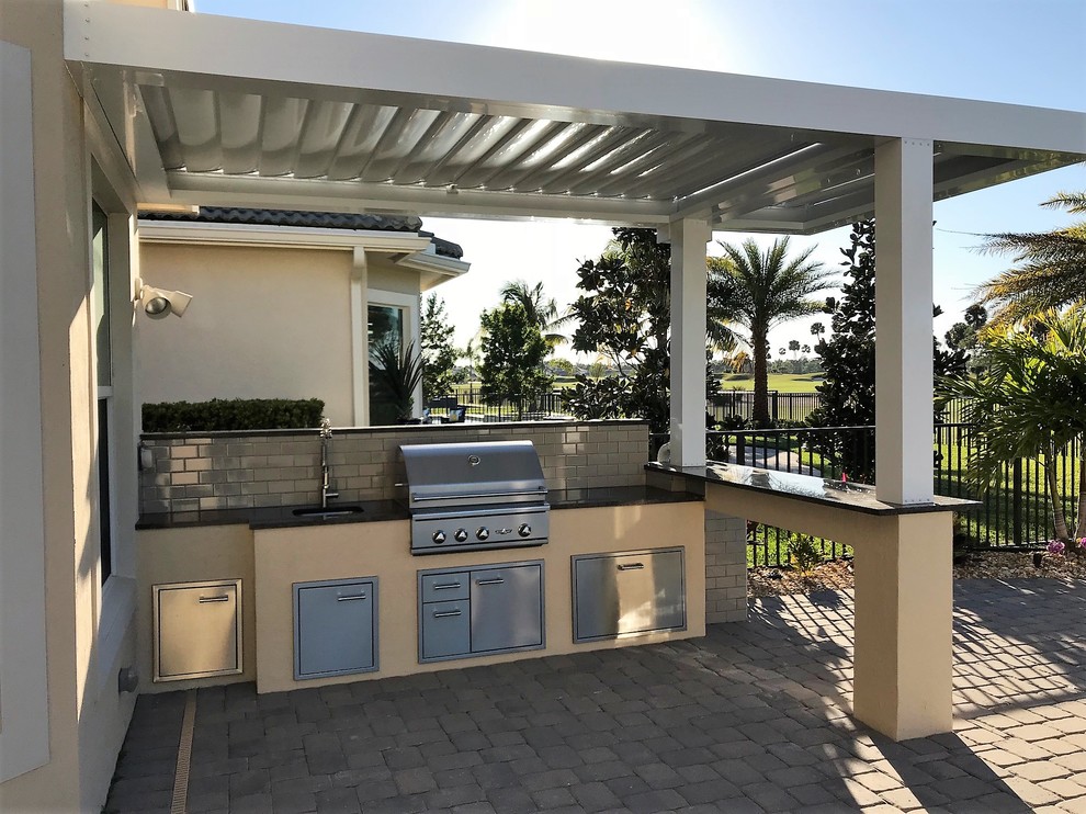 Mid-sized tuscan home design photo in Miami