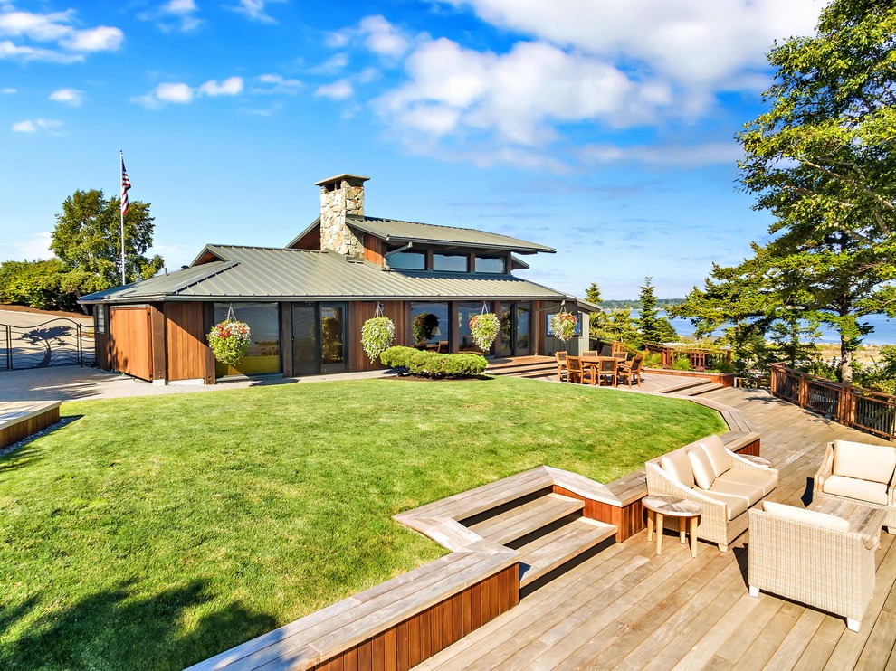 This is an example of a beach style backyard deck in Seattle.