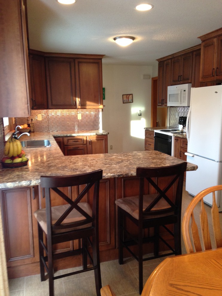 Small transitional u-shaped eat-in kitchen photo with an undermount sink, flat-panel cabinets, medium tone wood cabinets, laminate countertops and a peninsula