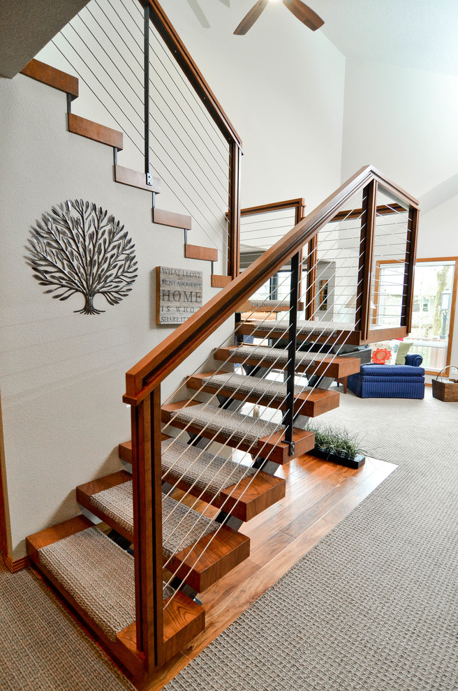 Design ideas for a mid-sized modern carpeted u-shaped staircase in Portland with open risers and cable railing.