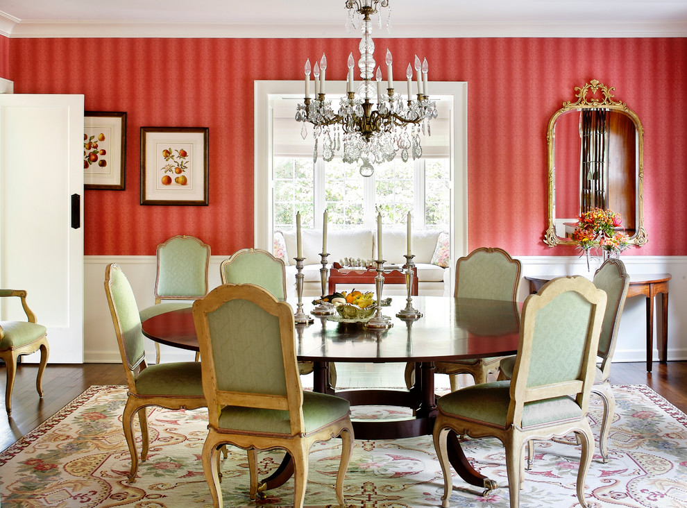 Design ideas for a traditional separate dining room in Chicago with red walls.