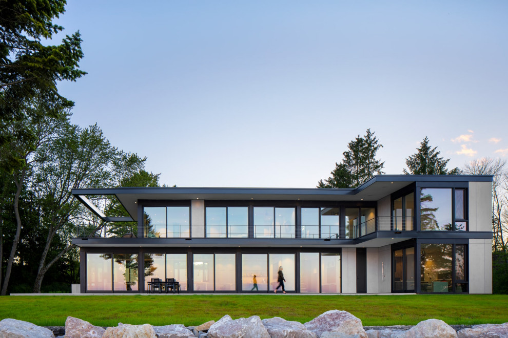 Foto de fachada de casa negra minimalista grande de dos plantas con tejado plano