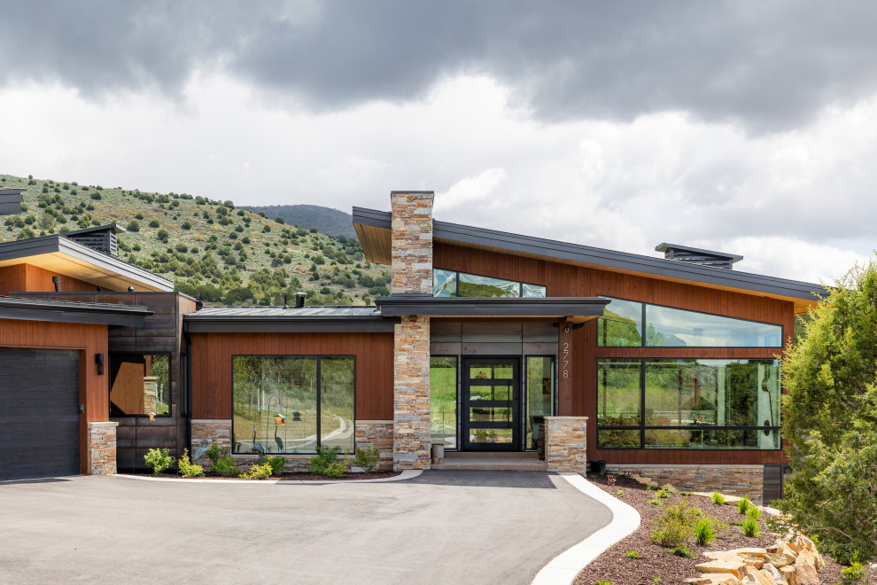 Trendy brown one-story wood house exterior photo in Salt Lake City with a shed roof, a metal roof and a gray roof