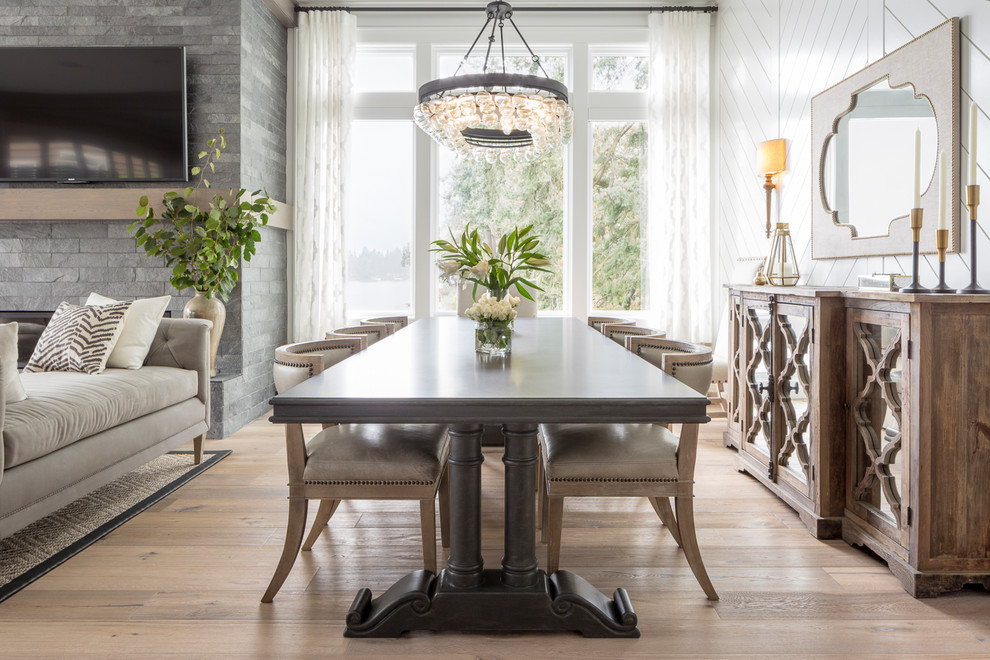 This is an example of a transitional dining room in Portland.