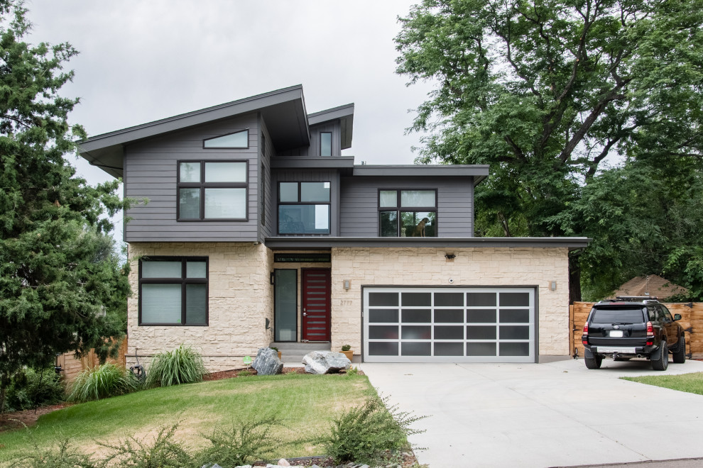 Inspiration for a mid-sized contemporary gray two-story mixed siding house exterior remodel in Denver with a shed roof and a shingle roof