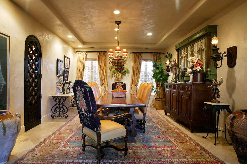 Inspiration for an expansive mediterranean separate dining room in Sacramento with beige walls and limestone floors.
