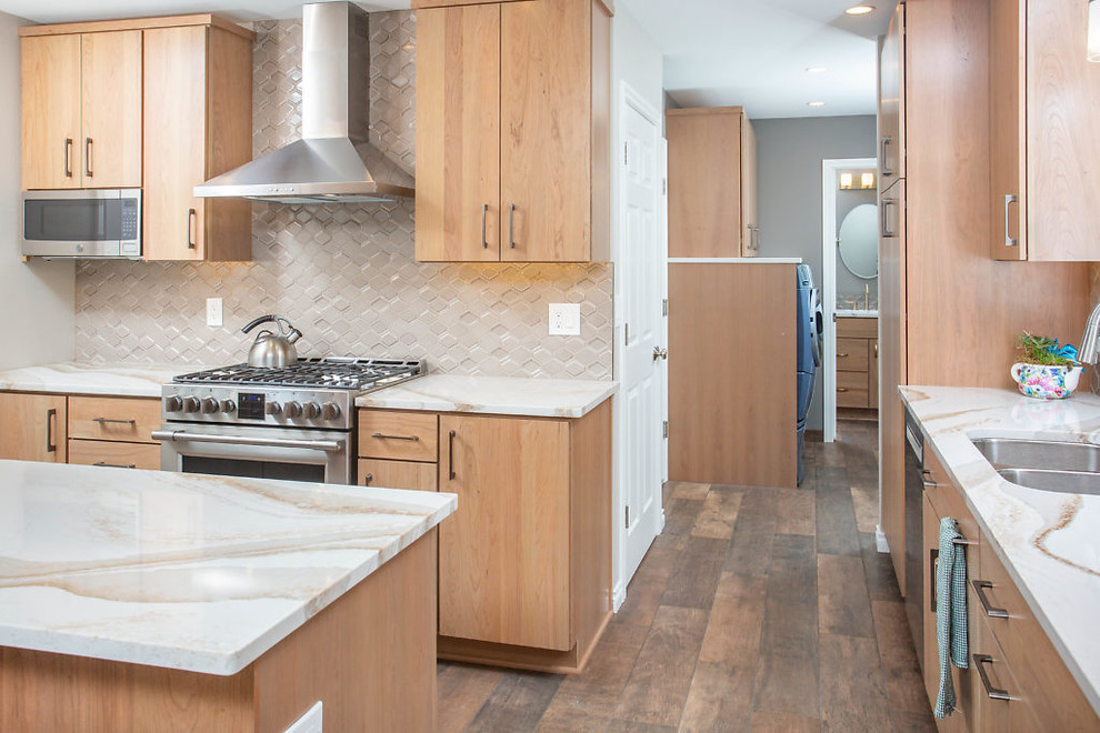 Mid-sized transitional galley eat-in kitchen photo with flat-panel cabinets, medium tone wood cabinets, quartz countertops and stainless steel appliances