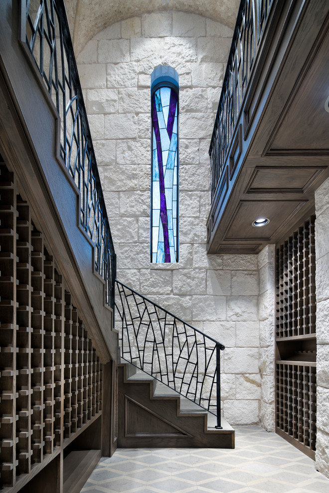 Inspiration for an expansive transitional wine cellar in Austin with ceramic floors and storage racks.