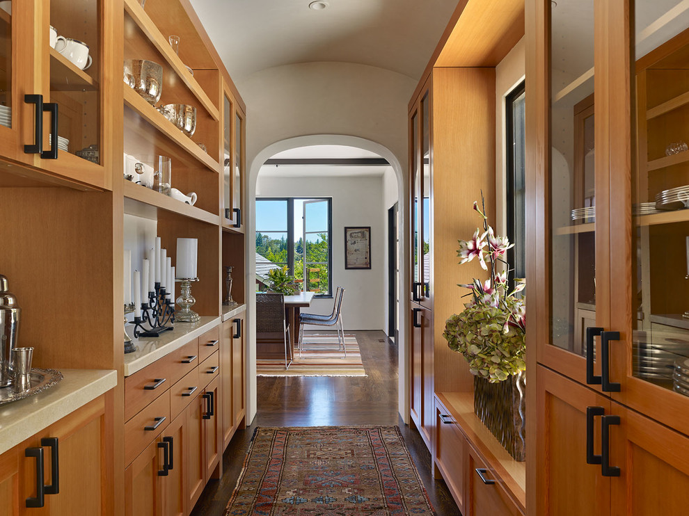 This is an example of a mediterranean hallway in San Francisco with dark hardwood floors.