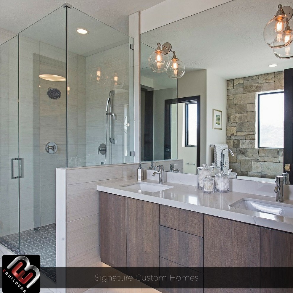 Photo of a mid-sized contemporary master bathroom in Salt Lake City with flat-panel cabinets, dark wood cabinets, a freestanding tub, an alcove shower, a two-piece toilet, multi-coloured tile, porcelain tile, grey walls, porcelain floors, an integrated sink and engineered quartz benchtops.