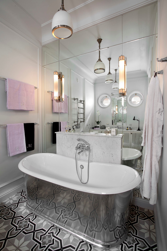 Photo of a traditional master bathroom in Moscow with a freestanding tub and white walls.