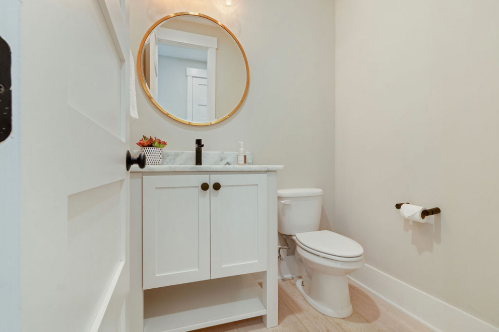Beach style powder room photo in Other