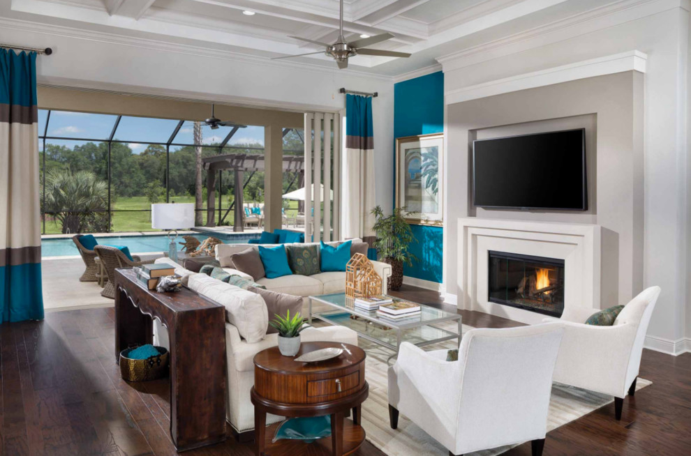 Design ideas for a large transitional formal open concept living room in Miami with beige walls, dark hardwood floors, a standard fireplace, a plaster fireplace surround, a wall-mounted tv and brown floor.