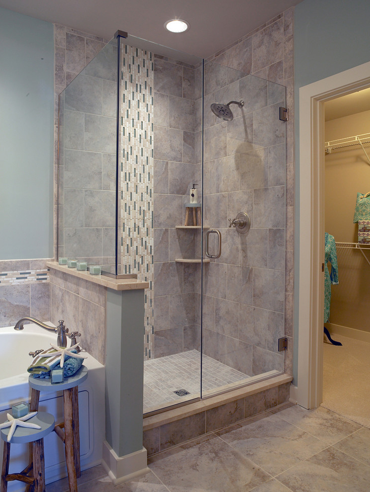 Mid-sized transitional master gray tile and ceramic tile ceramic tile drop-in bathtub photo with blue walls, shaker cabinets, white cabinets, laminate countertops, a drop-in sink and a one-piece toilet
