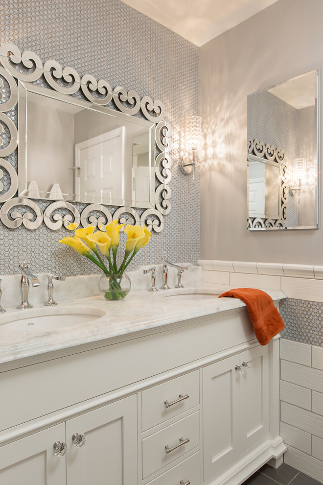 Inspiration for a mid-sized transitional kids bathroom in St Louis with shaker cabinets, white cabinets, an alcove tub, a shower/bathtub combo, a two-piece toilet, green tile, ceramic tile, grey walls, ceramic floors, an undermount sink, marble benchtops, grey floor, a hinged shower door and yellow benchtops.
