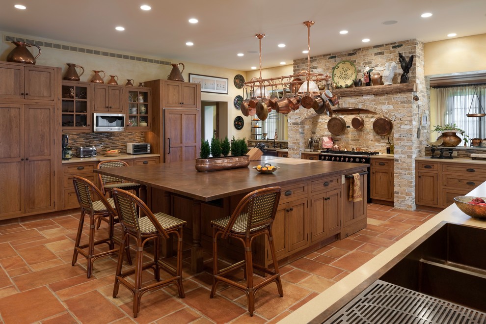 This is an example of a mediterranean kitchen in Philadelphia with copper benchtops.