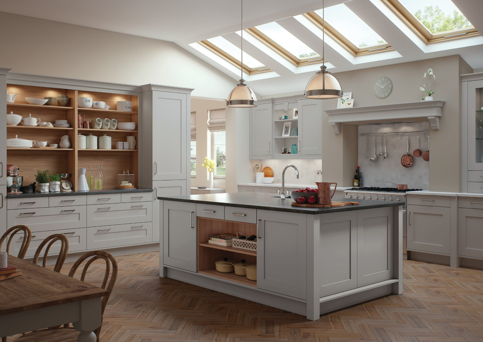 Large country u-shaped eat-in kitchen in Other with recessed-panel cabinets, grey cabinets, grey splashback, medium hardwood floors and with island.