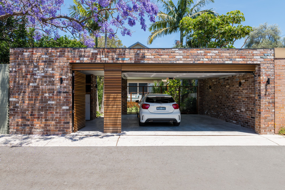 Пример оригинального дизайна: отдельно стоящий гараж среднего размера в стиле модернизм для двух машин