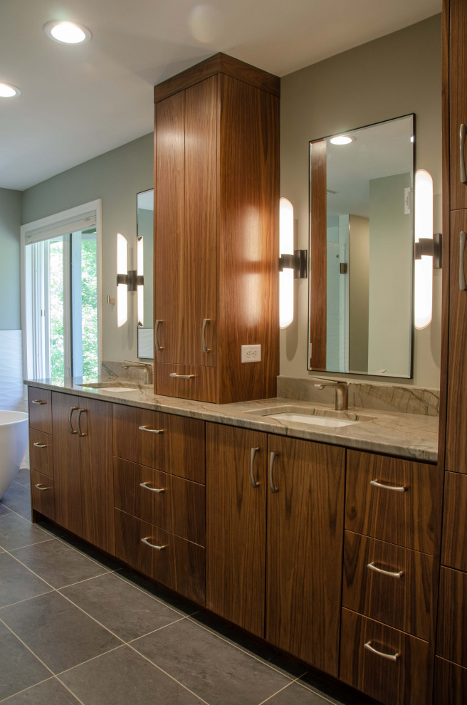 Inspiration for a large contemporary master bathroom in Minneapolis with flat-panel cabinets, dark wood cabinets, a freestanding tub, a corner shower, ceramic floors, an undermount sink, granite benchtops, brown floor, a hinged shower door, beige benchtops and a built-in vanity.
