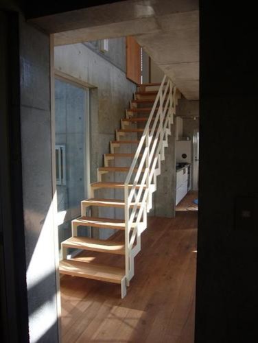Inspiration for a modern wood straight staircase in Tokyo with metal railing.