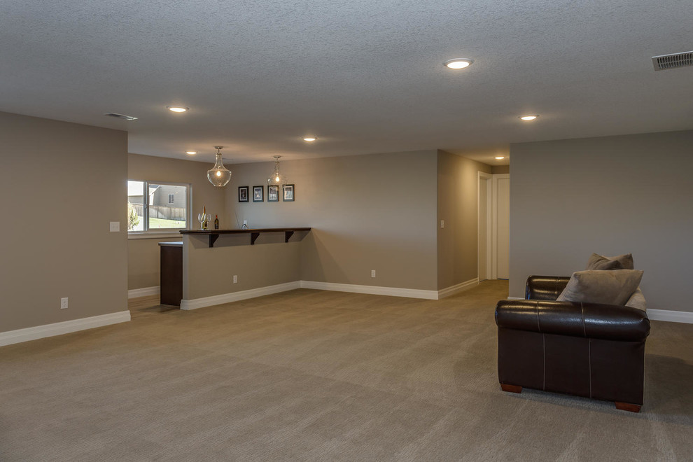 Photo of a mid-sized transitional open concept family room in Wichita with beige walls and carpet.