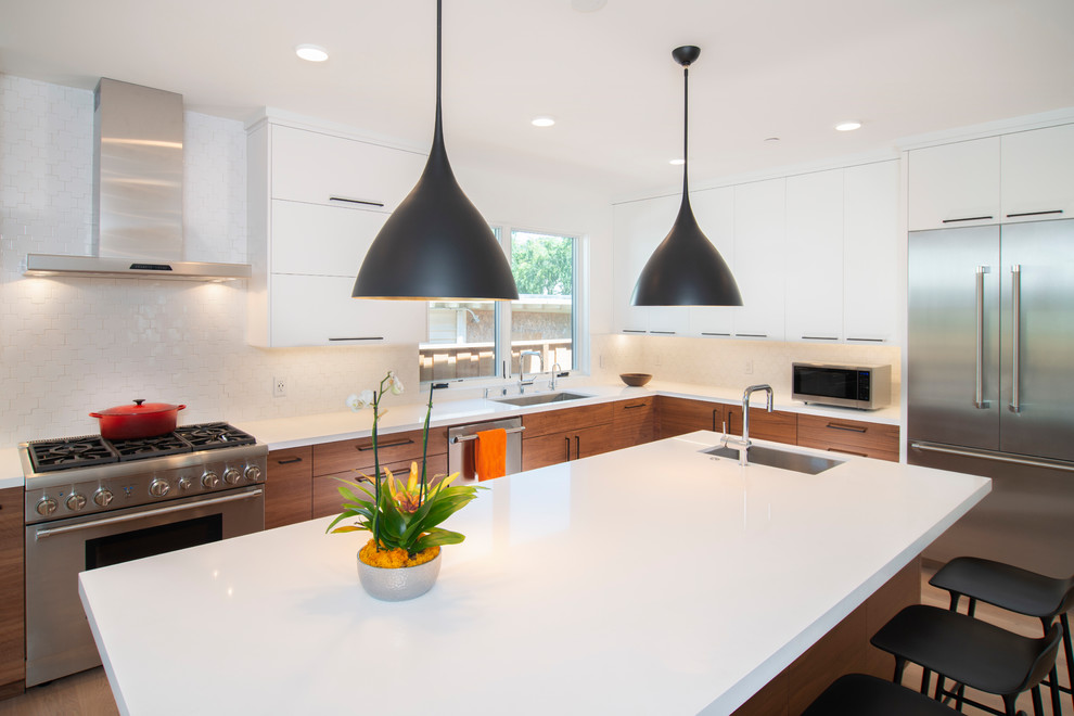 Design ideas for a contemporary l-shaped kitchen in San Francisco with flat-panel cabinets and medium wood cabinets.