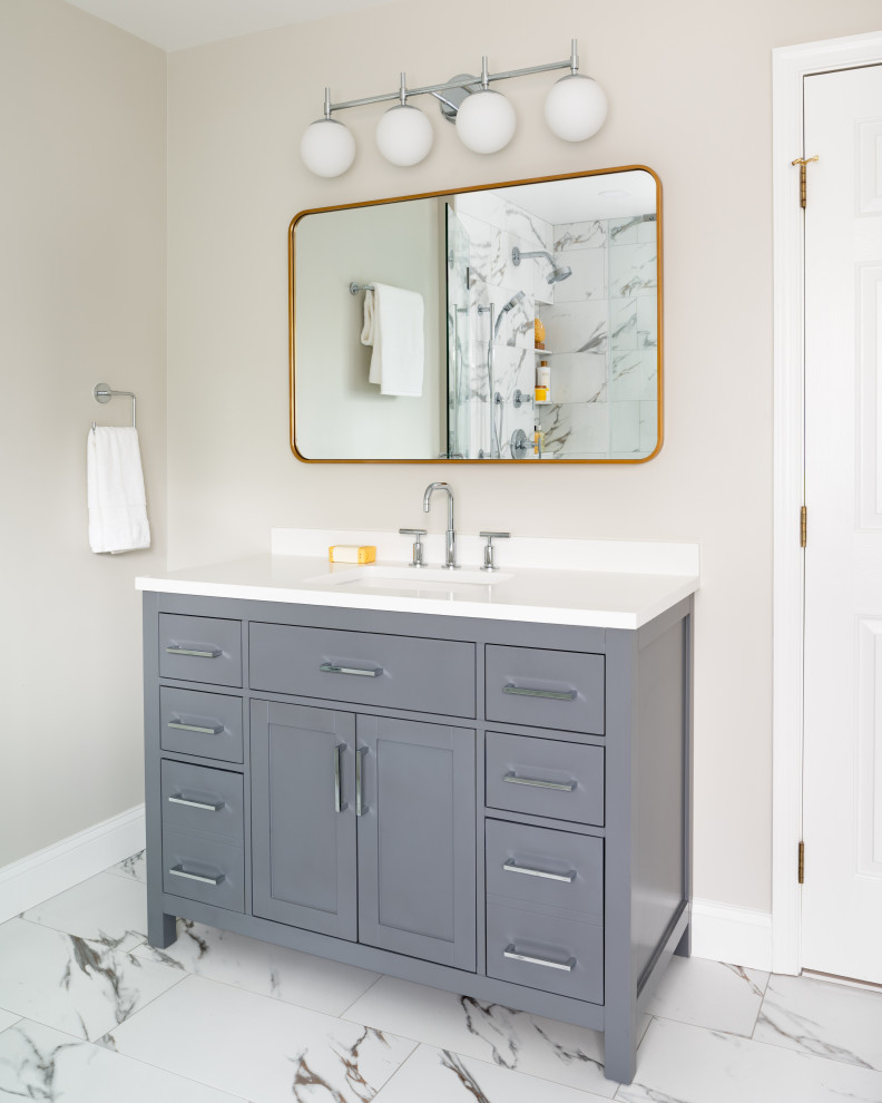 Inspiration for a large contemporary master white tile and porcelain tile porcelain tile, white floor and double-sink bathroom remodel in DC Metro with shaker cabinets, gray cabinets, a two-piece toilet, gray walls, an undermount sink, quartz countertops, a hinged shower door, white countertops, a niche and a freestanding vanity