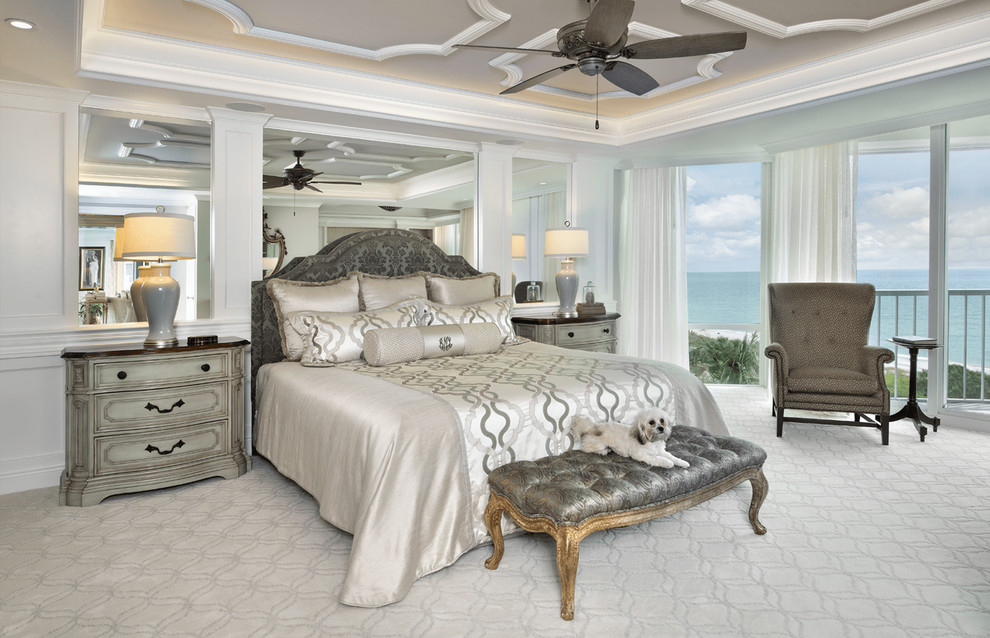 Design ideas for a traditional master bedroom in Miami with carpet.