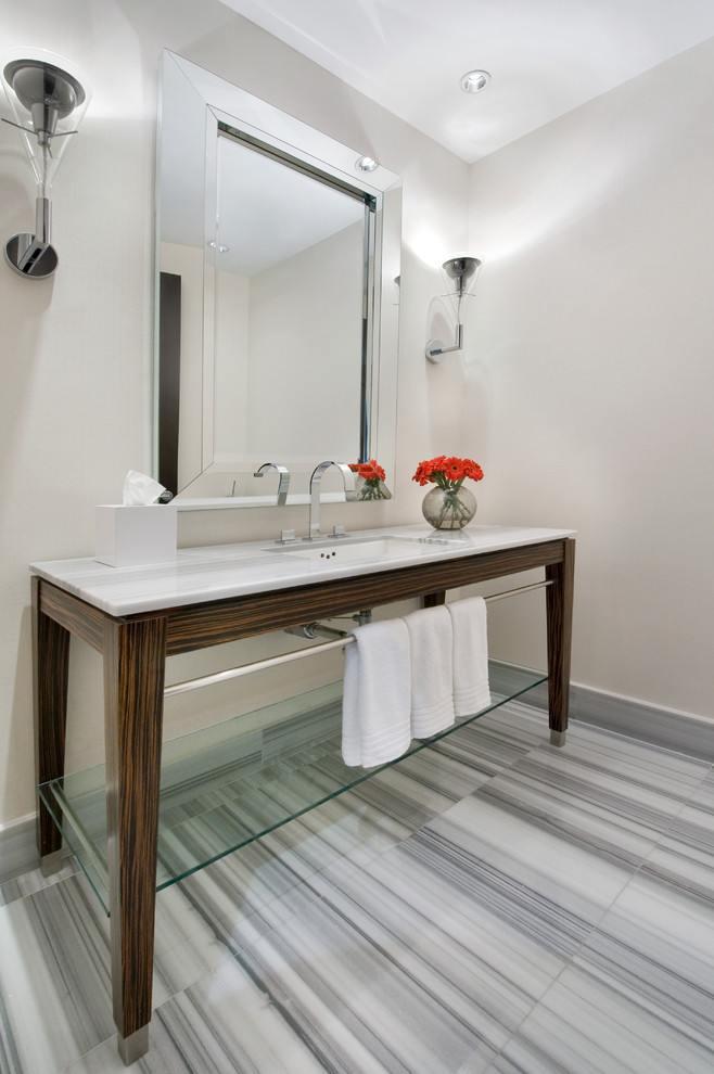 This is an example of a contemporary powder room in Miami with an undermount sink and open cabinets.
