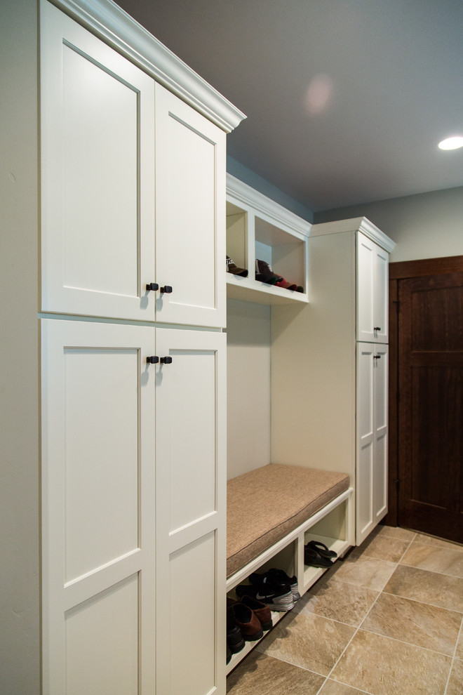 Inspiration for a traditional laundry room in Portland with an utility sink, shaker cabinets, white cabinets, laminate benchtops, beige walls and a side-by-side washer and dryer.