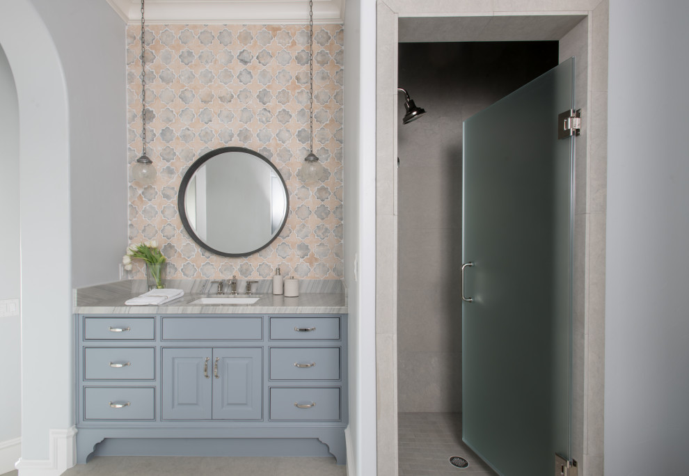 Photo of a large 3/4 bathroom in Dallas with beaded inset cabinets, blue cabinets, a corner shower, multi-coloured tile, marble, blue walls, an undermount sink, marble benchtops, a hinged shower door, grey benchtops, a single vanity and a built-in vanity.
